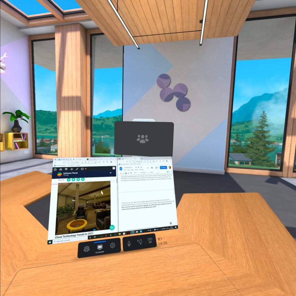 A desktop screen hovers over an office table in a virtual environment overlooking the mountains